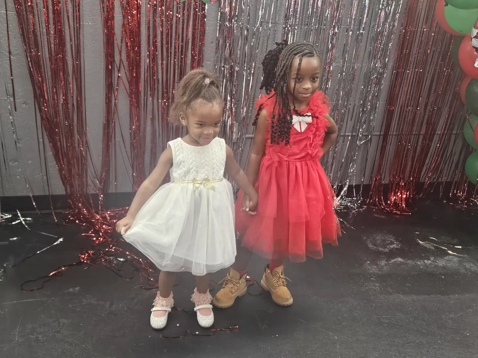 Children in holiday dresses at Christmas party