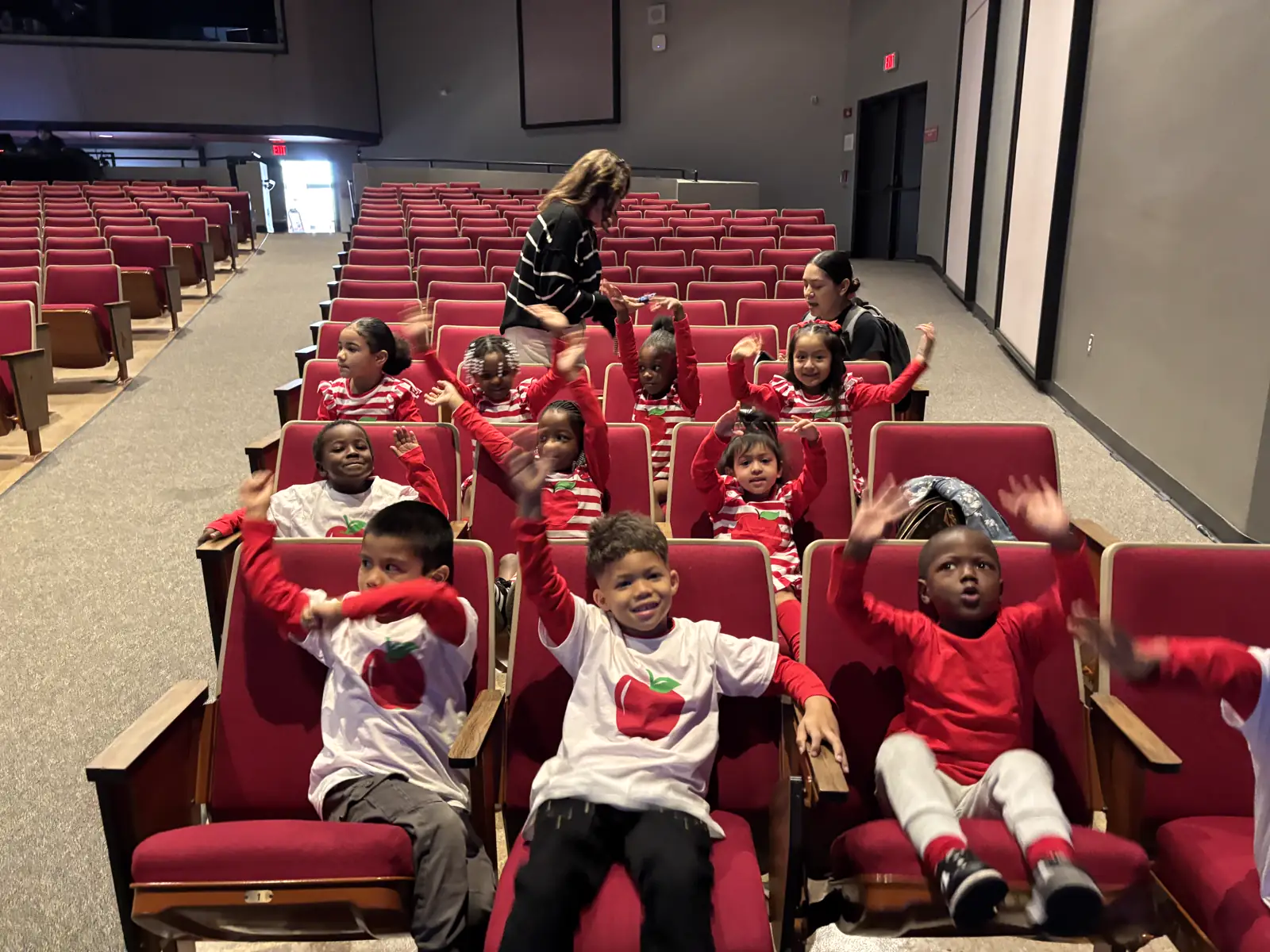 Children in Christmas outfits at theater outing