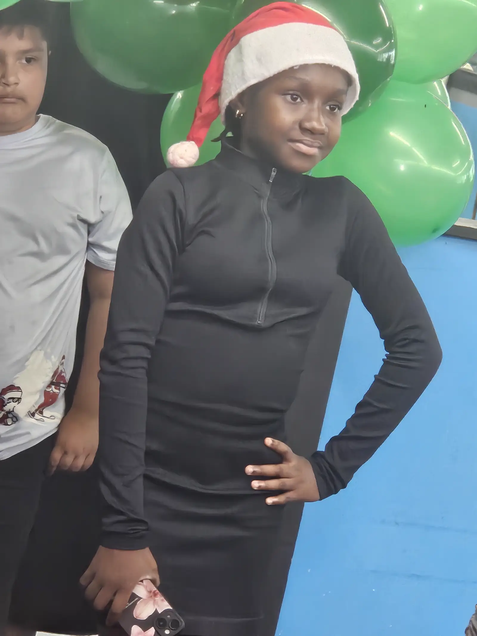 Child in ninja costume at indoor Halloween event