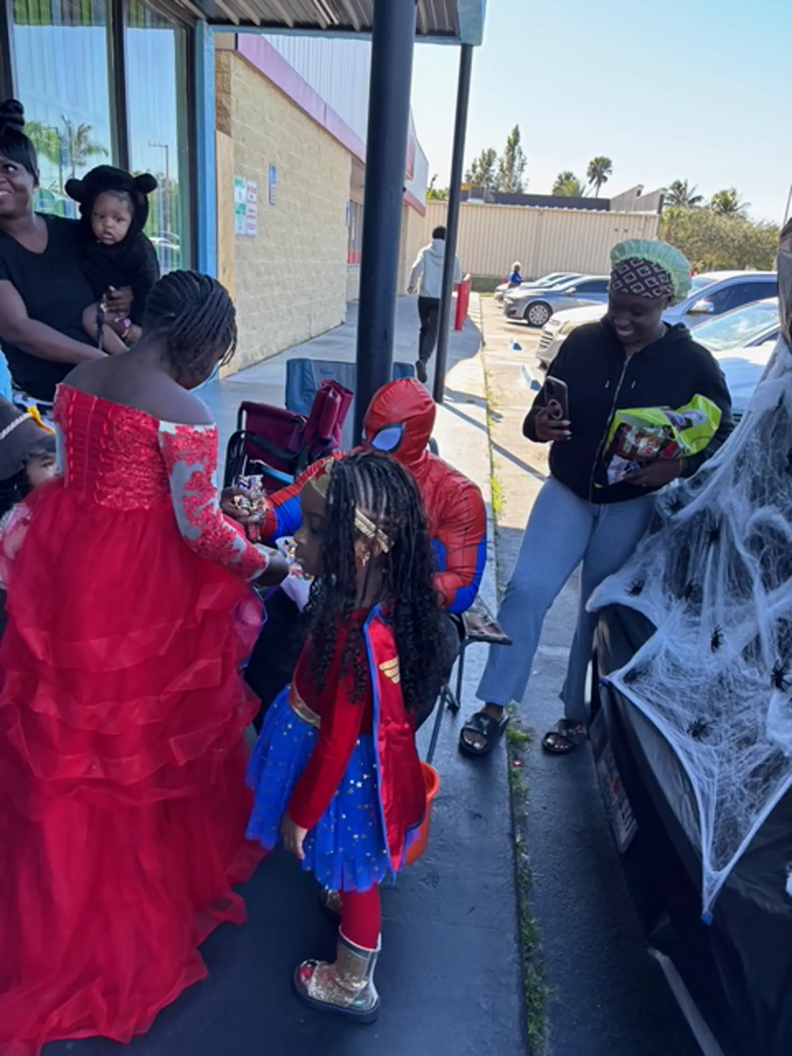 Children trick or treating outside the center